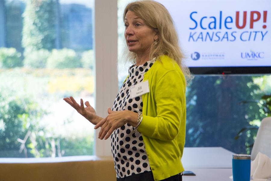 Jill Meyer converses with a business owner in the ScaleUP! Kansas City program