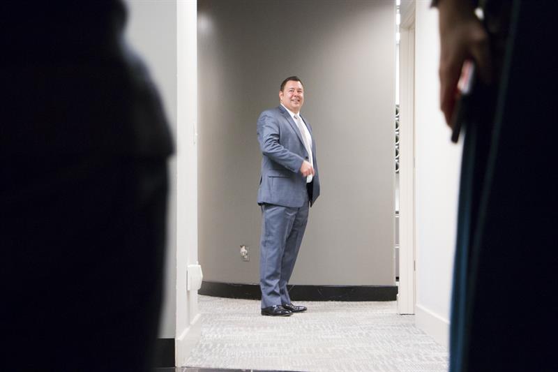 Joe Vazquez of Vazquez Commercial Contracting looks down the hall of his business' headquarters in Kansas City, Missouri